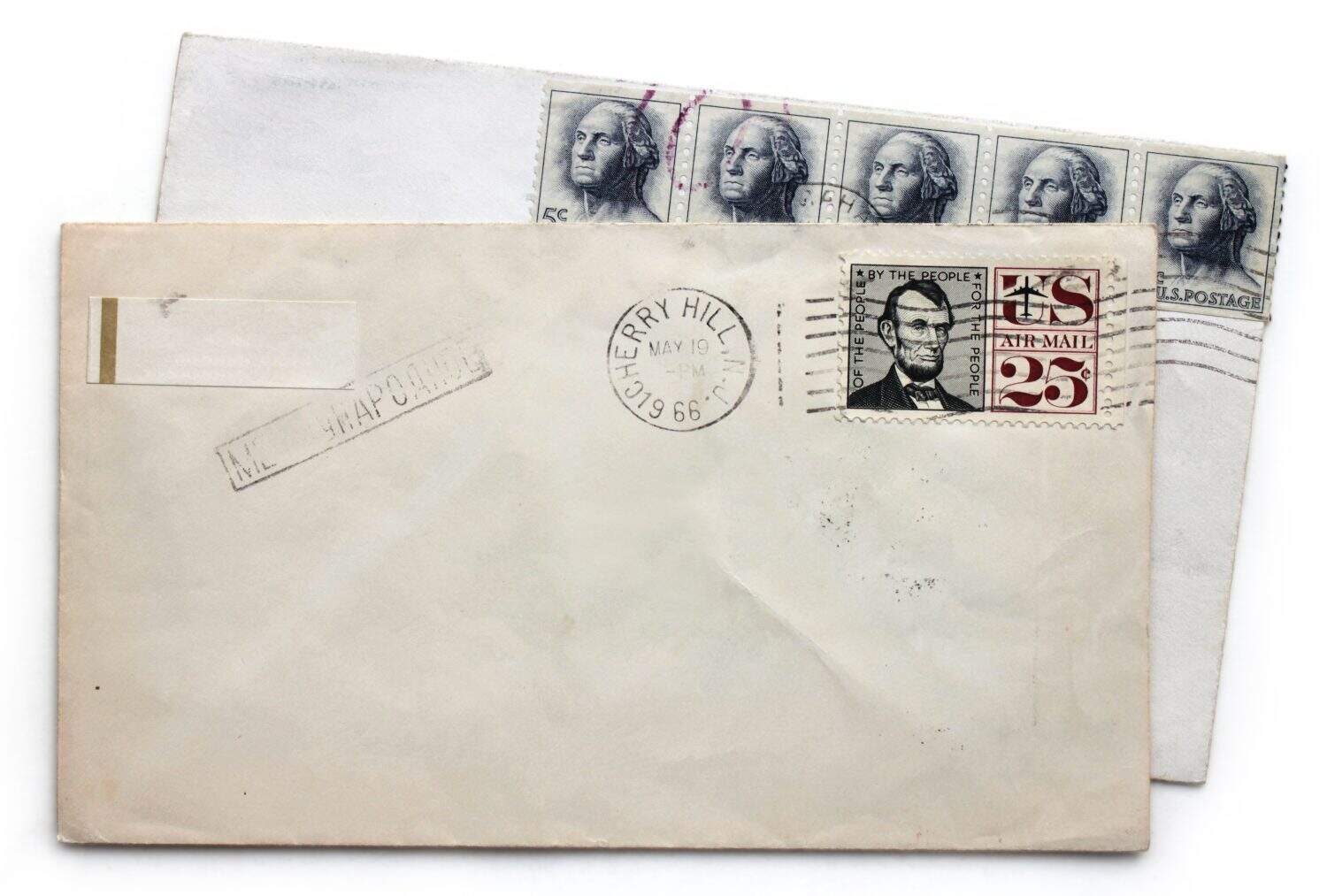 Two vintage airmail envelopes with Abraham Lincoln and George Washington postage stamps from USA.