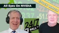 Two men, one wearing headphones, smiling and facing the viewer. The background features blurred financial numbers, green upward arrows, and text overlays including "All Eyes On NVIDIA," "STOCK WATCH," and the "24/7 WALL ST" logo.