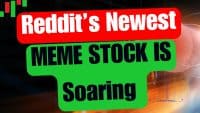 A graphic shows the phrase 'Reddit's Newest MEME STOCK IS Soaring'. 'Reddit's Newest' is in white text on a red rounded rectangular bar. 'MEME STOCK IS Soaring' is in black text on a green rounded shape below. The background features blurred financial candlestick charts and abstract light effects.