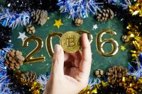 Festive 2026 Celebration With Bitcoin Coin Held By Hand Amid Gold Numbers And Decor