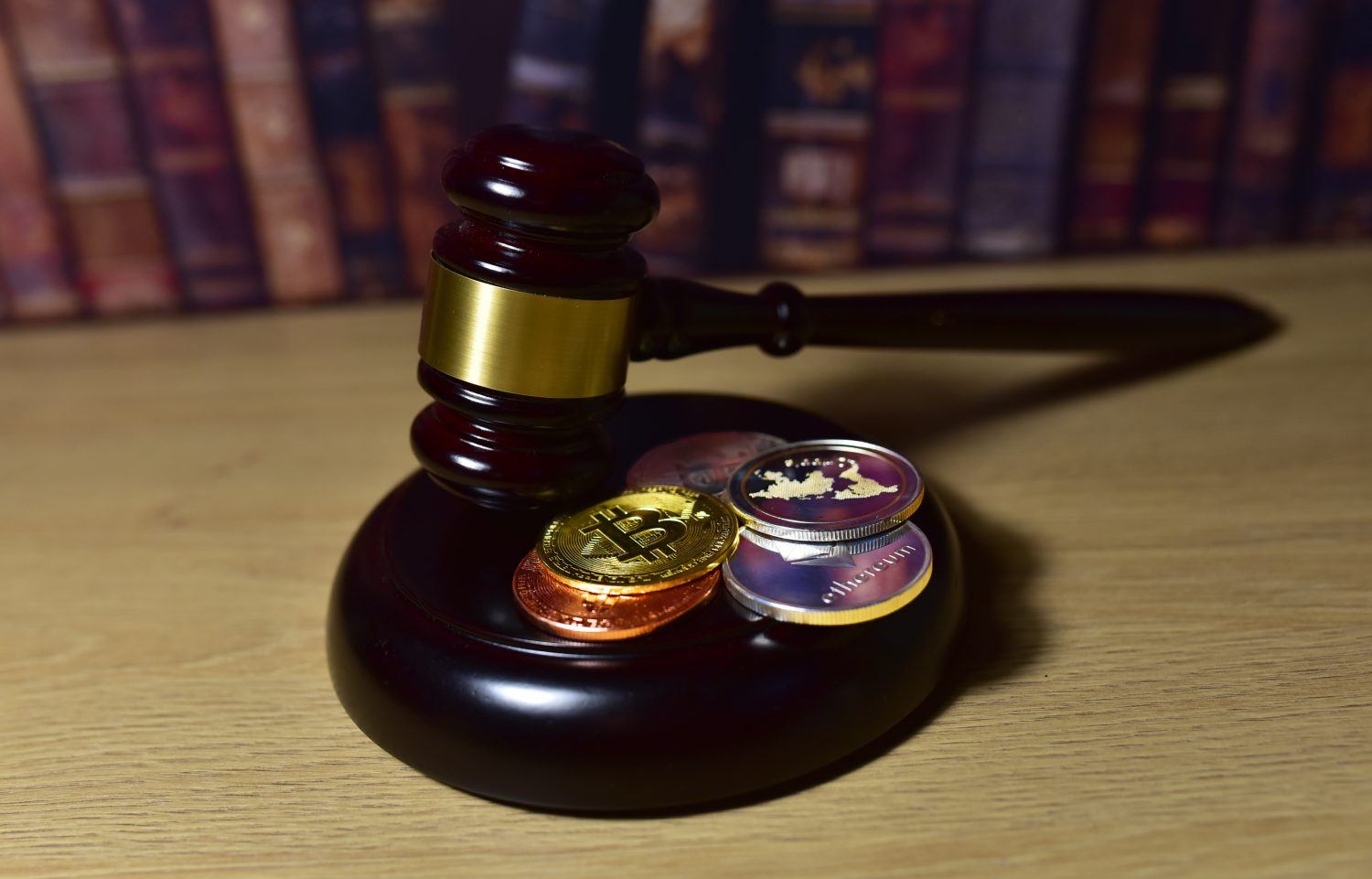 Judge hammer and BTC gold crypto coin. Justice courtroom. Ripple XRP demands Bitcoin and Ethereum docs from SEC amid legal fight. Delist сryptocurrency trading. Exchanges and traders. law to ban