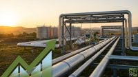 Industrial oil and gas infrastructure with silver pipelines and storage tanks at sunset, featuring a large green upward growth arrow graphic in the foreground.