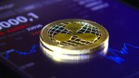 Gold coins of the ripple on the background of a graphic stock chart. The Concentration of the Crypto-Currency of Virtual Money