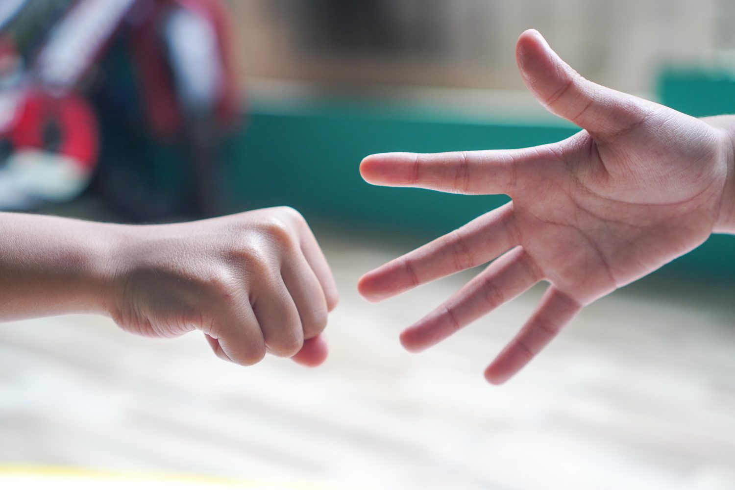 hands playing rock paper scissors game. Rock paper scissors game process. Funny fights and games for kids.