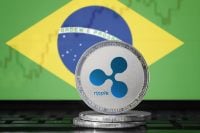 RIPPLE (XRP) cryptocurrency; physical concept ripple coin on the background of the flag of BRAZIL