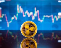 Bitcoin and XRP, gold virtual bit coin and xrp money currency on digital candle stick graph chart background