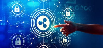 A vibrant blue background features a network of glowing white digital lines, interconnected circles, arrows, and various tech icons including multiple padlocks and data graphs. A large central circle frames a white symbol resembling the Ripple (XRP) logo. A human hand extends from the right, with an orange-glowing fingertip pointing towards the central Ripple-like icon.