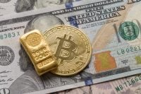 Gold Bullion and Bitcoin Cryptocurrency on 100 US Dollar