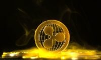 Ripple gold physical coin. XRP coin on black background