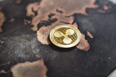 Gold Ripple XRP Coin Token on World Map in Africa