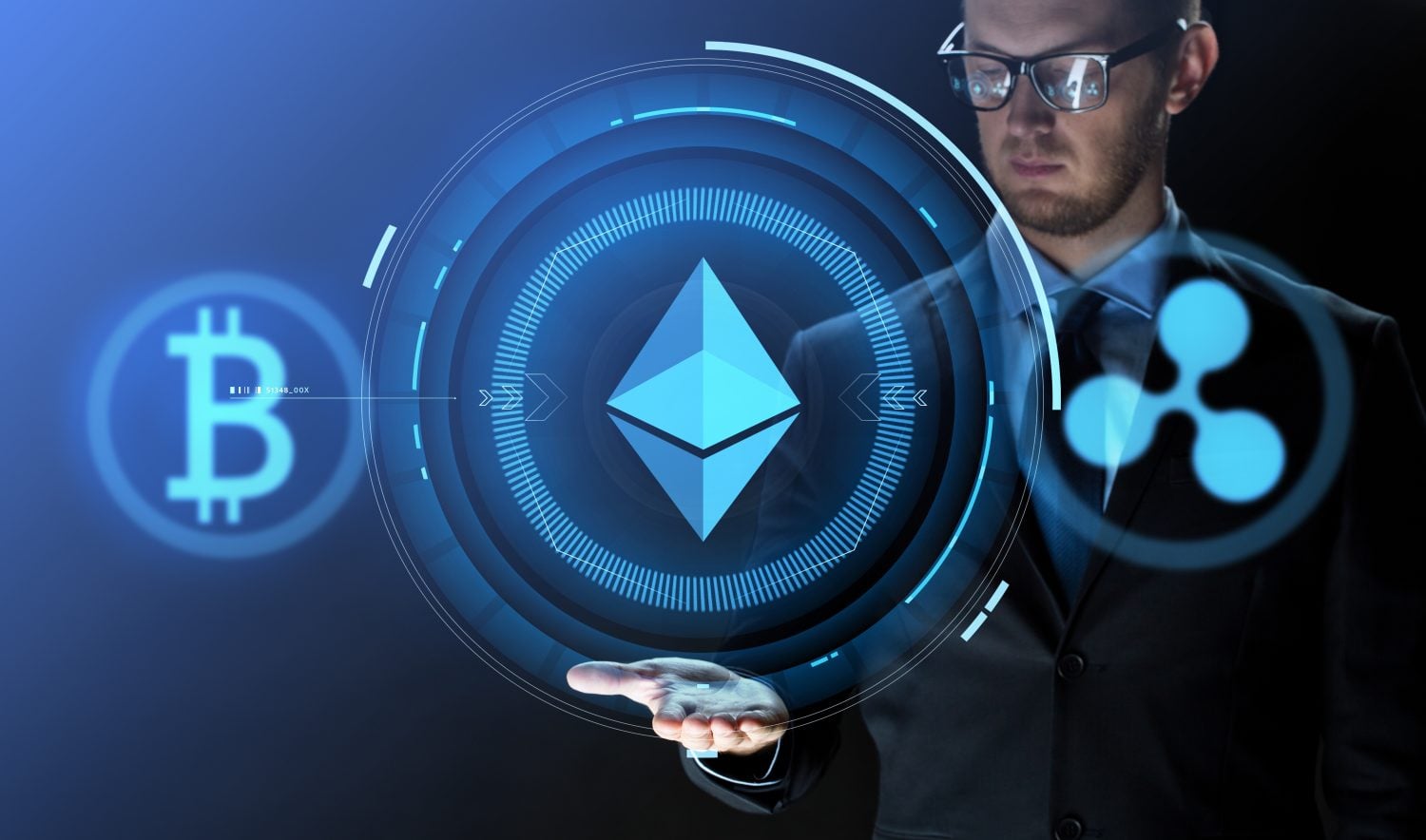 cryptocurrency, financial technology and business concept - close up of businessman with bitcoin, ethereum and ripple icons on virtual screen over dark background