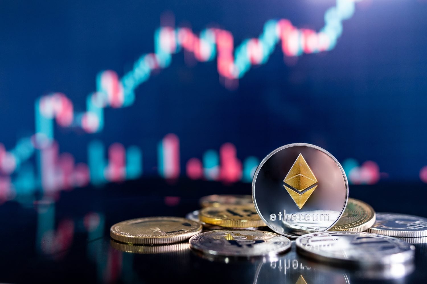 Ethereum (ETH) and other crypto coins with blurred candlestick chart. Ethereum is a decentralized, open-source blockchain with smart contract. Cryptocurrency and decentralized finance concept