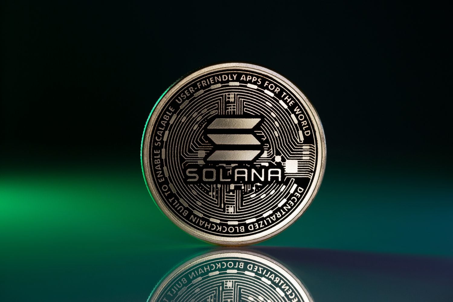 Solana SOL Physical Coin Placed on Reflective Surface and lit with green light