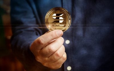 Solana SOL stablecoin cryptocurrency golden coin in hand abstract concept