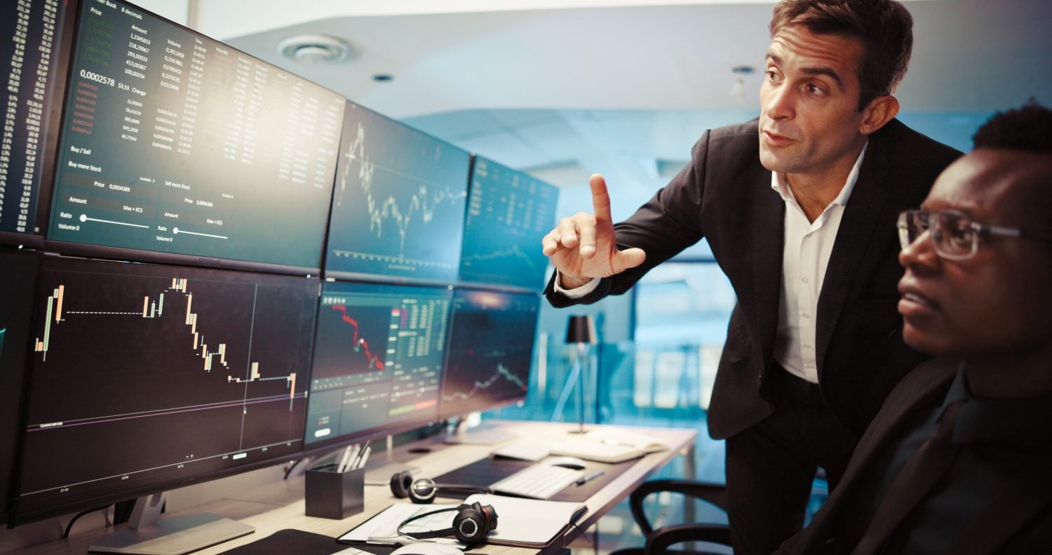 Computer screen, trading and men in office, conversation and internet with financial growth. Employees, traders and advice for investment, pc and fintech with website info for stock market and stats