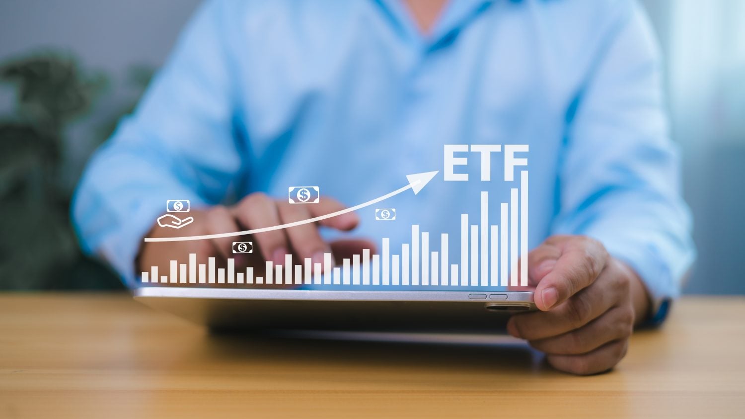 Investor using tablet to analyze ETF growth chart, representing financial success, smart investment strategy, stock market performance, and wealth building through exchange traded funds.