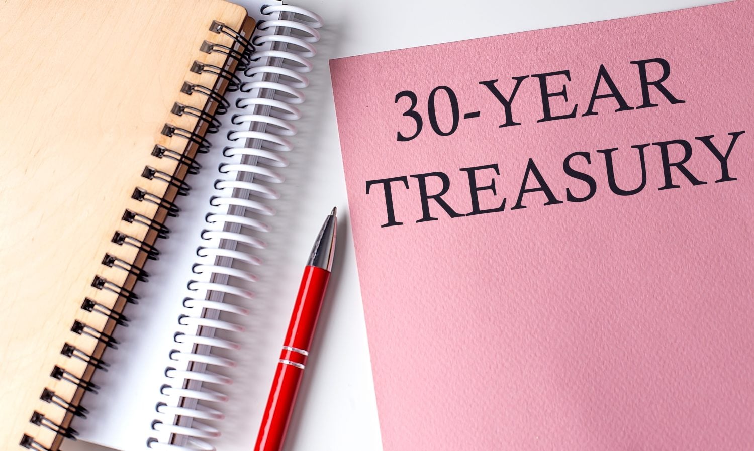 30-YEAR TREASURY word on pink paper with office tools on white background