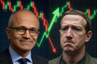 A split image features two prominent tech CEOs. On the left, Microsoft CEO Satya Nadella smiles confidently, wearing glasses and a blue shirt with a dark tie, set against a dark background with green rising stock candlesticks and a bright green upward arrow. On the right, Meta CEO Mark Zuckerberg appears somber and frowning, dressed in a dark jacket, with red falling stock candlesticks and a prominent red downward arrow behind him. The overall background is a dark financial market chart.