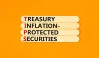 TIPS symbol. Concept word TIPS Treasury Inflation Protected Securities on beautiful sticks. Beautiful orange background. Business TIPS Treasury Inflation Protected Securities concept. Copy space.