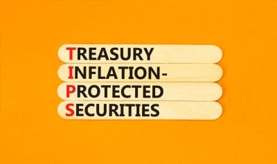 TIPS symbol. Concept word TIPS Treasury Inflation Protected Securities on beautiful sticks. Beautiful orange background. Business TIPS Treasury Inflation Protected Securities concept. Copy space.