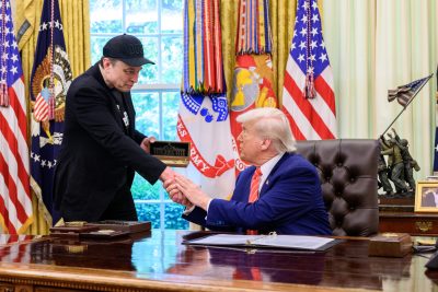 Elon Musk and Donald Trump in the Oval Office.