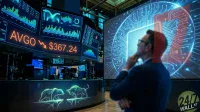 A blurred man in a dark suit and glasses looks thoughtfully at a large screen displaying a glowing blue circuit board and microchip graphic. To his left, multiple digital monitors show financial charts, graphs, and a prominent orange ticker for 'AVGO' with a downward arrow next to '$367.24'. The trading floor's counter features illuminated, wireframe-style bear and bull market symbols. A '24/7 WALL ST' logo is visible in the bottom right corner.