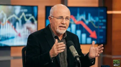 A balding man with a short gray beard and glasses, wearing a dark jacket over a charcoal shirt, speaks animatedly into a studio microphone. Behind him, two large screens display various financial graphs; the right screen features a large red arrow pointing downwards over a blue chart. The man is looking slightly to his left, with his mouth open as if mid-sentence, and his hands are raised and open in a gesturing motion.
