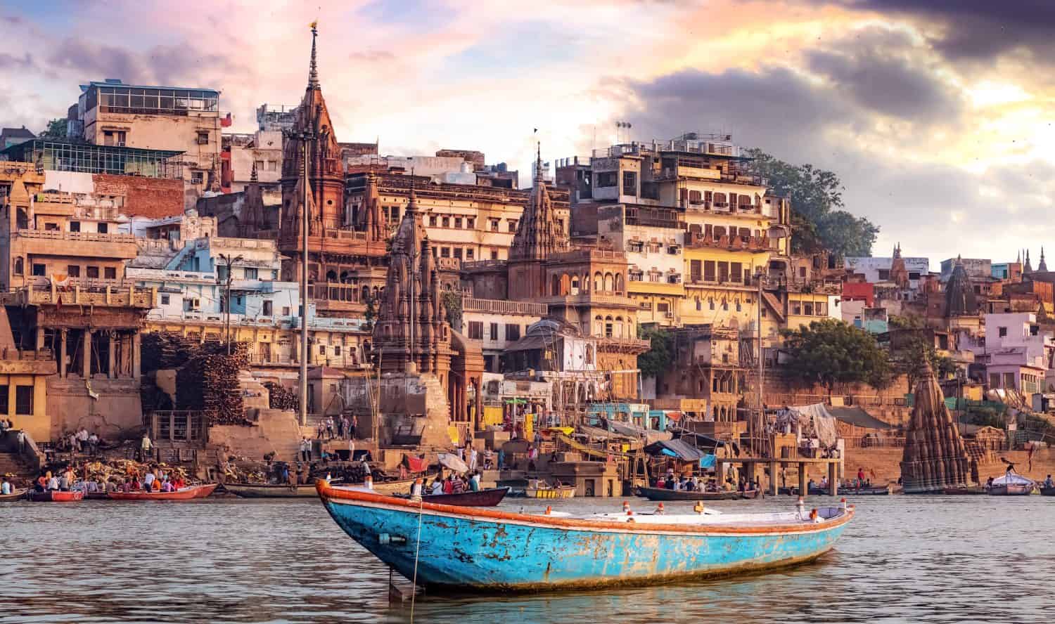 Varanasi city with ancient architecture. View of the holy Manikarnika ghat at Varanasi India at sunset.