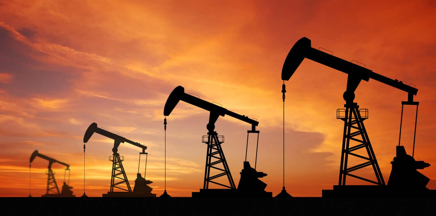 Oil pump oil rig energy industrial machine for petroleum in the sunset background for design