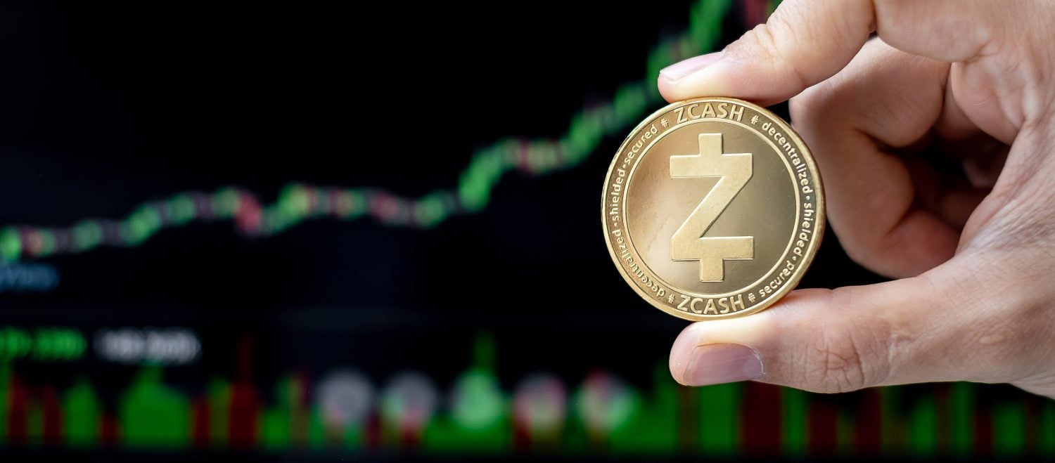 Golden Zcash (ZEC) cryptocurrency coin with candle graph background, Crypto is Digital Money within the blockchain network, is using technology and online internet exchange.