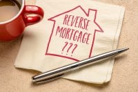 reverse mortgage question - writing and sketch on a napkin, finance and retirement concept