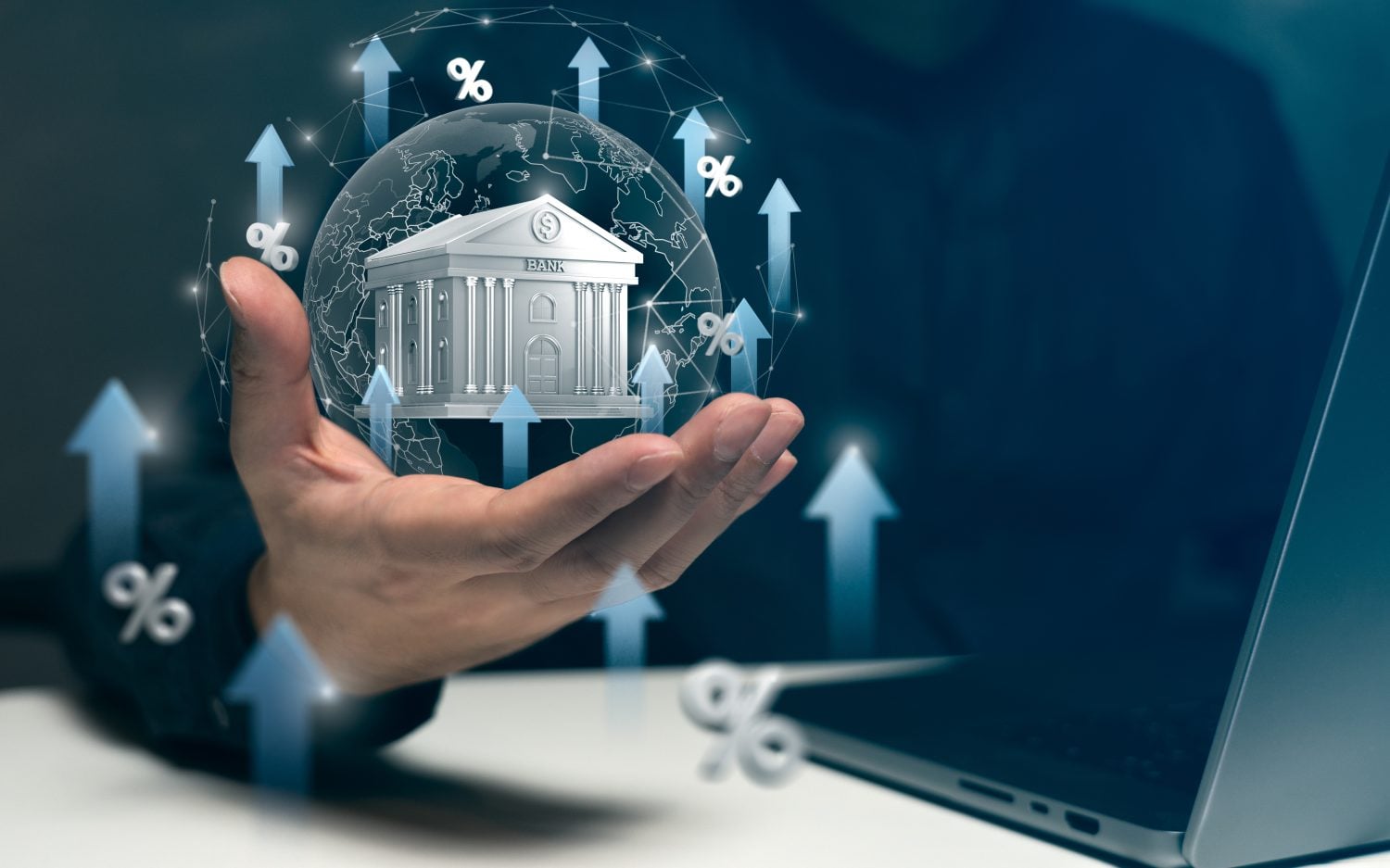 A hand holds a virtual bank surrounded by arrows and percentage signs, symbolizing rising interest rates and banking growth trends.