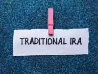 Traditional IRA writting on blue background.