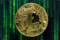 Cryptocurrency concept. A close up shot of Litecoin cryptocurrency coin in front of a green matrix screen. selective focus in the center.