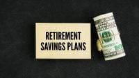 A roll of paper money and papers with the words retirement savings plans. structured financial strategies designed to help you build wealth for when you stop working.