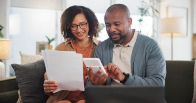 Home, documents and senior couple with laptop, calculator and financial planning. Apartment, man and woman with paperwork, budget and retirement fund with internet, connection and taxes in lounge