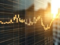 Close-up view of a glowing financial chart displayed on a digital screen, with a blurred cityscape and sunlight in the background. The chart represents market trends, stock analysis, and economic data