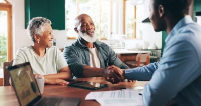 Handshake, meeting and old couple with financial advisor for retirement fund, fraud protection and pension planning. Documents, greeting and shaking hands with people at home for account manager