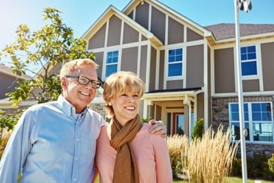 Old couple, hug and happy for new home, outdoor or property purchase with loan, bonding and together. Thinking, elderly man and senior woman with smile for retirement, real estate and relocation