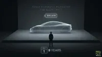 A monochromatic graphic depicts a sleek, translucent outline of the Tesla Roadster on a raised platform in a dark, minimalist setting. A lone human silhouette stands before it. Above the car, text reads "TESLA'S UNBUILT ROADSTER THE $250K WAIT" and a glowing price tag shows "$250,000". Below, a calendar icon indicates "OCT 1" next to "9 YEARS". The 24/7 Wall St. logo is in the bottom right corner.