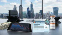A desk with a stack of US dollar bills, a tablet showing a financial chart with a red downward trend, a medical insurance card, and a vial labeled 'GLP-1 weight-loss drug.' A red circle with a diagonal line over a shield icon indicates no coverage for the drug on the insurance card. The background is a blurred office window view of a city skyline with modern skyscrapers under a blue sky.