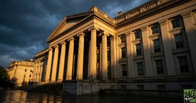 Using the Treasury building as a symbol of institutional power provides a grounded, serious tone. The dramatic lighting and low angle make the economic shift feel monumental and historic, catering to the professional audience of 24/7 Wall St.