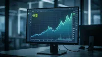 A close-up shot of a computer monitor displaying a stock chart for NVIDIA. The chart shows a significant upward trend with green and blue lines against a dark, grid-patterned background, indicating strong market growth. The NVIDIA logo is visible in the upper left corner. The monitor is set on a dark desk in an office environment with blurred reflections in the background.