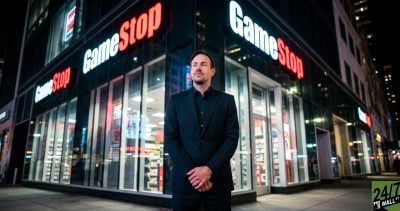 Juxtaposing a professional executive against the recognizable retail storefront creates a grounded, fact-based image. The neon reflections and modern aesthetic avoid 'stock photo' tropes while highlighting the brand's physical presence.