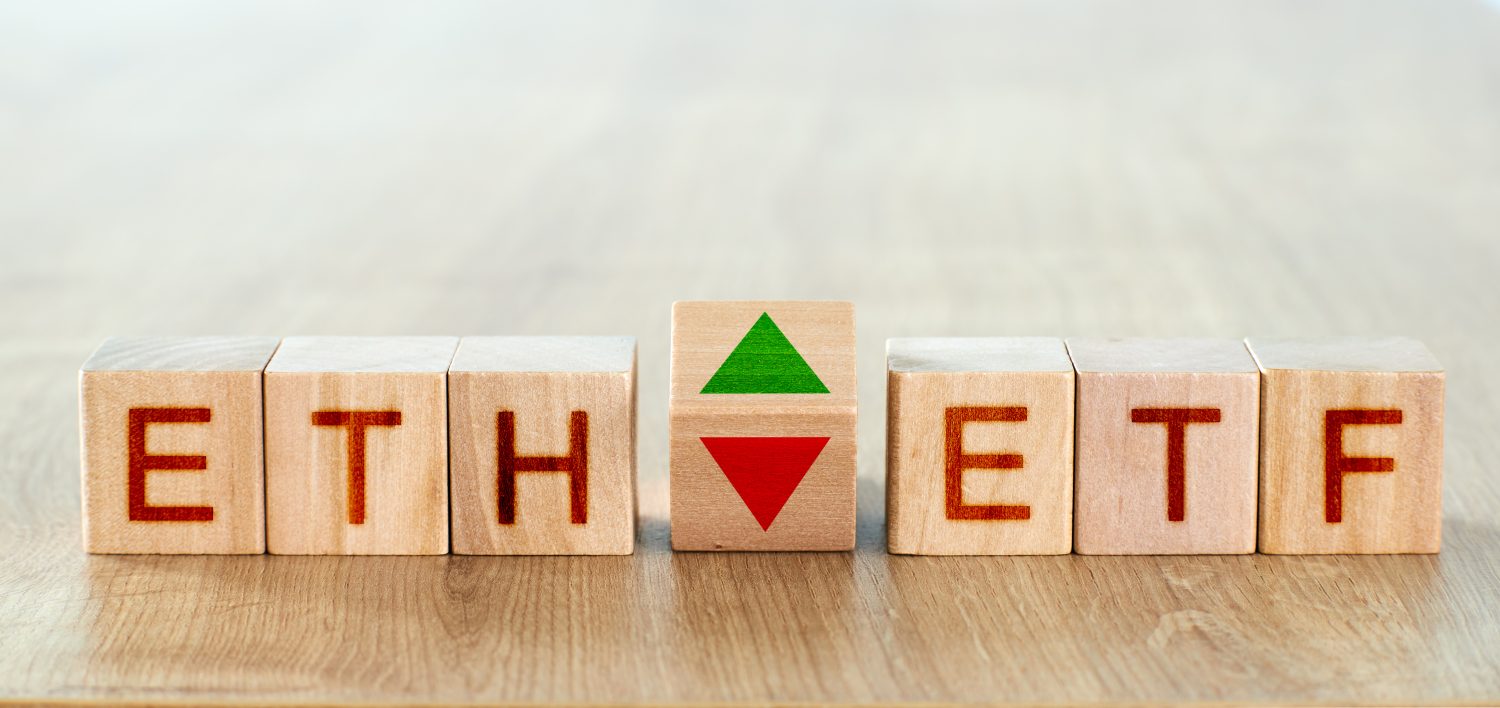 ethereum etf concept. wooden blocks with the inscription eth and etf, as well as arrows symbolizing the rise and fall of the cryptocurrency