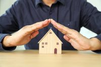 Financial planning for home loan concept hand and house for plan of money savings management for buy housing residential or family insurance or banking agreement.