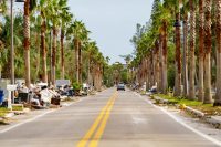 Home owners leaving piles of damaged furniture on the street after Hurricane Milton storm surge St Petersburg Beach