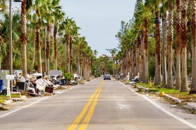 Home owners leaving piles of damaged furniture on the street after Hurricane Milton storm surge St Petersburg Beach