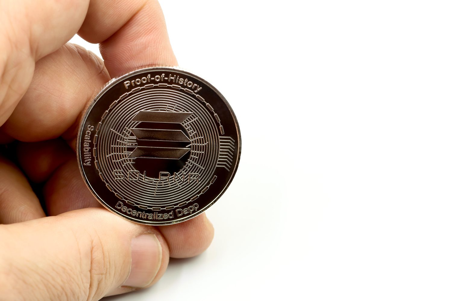 Hand showing a cryptocurrency Solana sol.