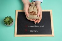 Certificate of Deposit. Financial product offered by banks and credit unions that allows individuals to deposit a fixed amount of money for a specified period in exchange for a higher interest rate.